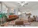Open-concept living space features stylish furniture and decor connected to the kitchen at 4050 Peaceful Dune St, Las Vegas, NV 89129