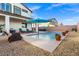 Refreshing swimming pool surrounded by lounge chairs, potted plants, and a clean patio area for outdoor enjoyment at 4050 Peaceful Dune St, Las Vegas, NV 89129