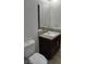 Bathroom features a modern vanity, granite countertop and a toilet at 4304 Gretna Green Ct, Las Vegas, NV 89110