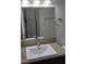 Bathroom features a light countertop, modern square sink, and a large mirror at 4304 Gretna Green Ct, Las Vegas, NV 89110
