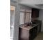 Well-lit kitchen with granite counters, stainless steel appliances, and ample storage at 4304 Gretna Green Ct, Las Vegas, NV 89110