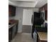 Efficient kitchen with stainless steel appliances, granite countertops, and tile flooring at 4304 Gretna Green Ct, Las Vegas, NV 89110