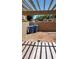 Covered patio area with brick and concrete flooring at 4304 Gretna Green Ct, Las Vegas, NV 89110