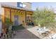 A cozy backyard featuring a covered patio, gravel, and some vegetation at 431 Las Casitas Way, Las Vegas, NV 89121