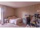 Cluttered bedroom featuring a bed, desk, and floral wallpaper at 431 Las Casitas Way, Las Vegas, NV 89121