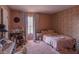 Cluttered bedroom featuring a bed, desk, and floral wallpaper at 431 Las Casitas Way, Las Vegas, NV 89121
