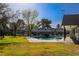 The community pool surrounded by landscaping and community buildings at 431 Las Casitas Way, Las Vegas, NV 89121