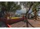 The community pool fenced in and surrounded by mature trees at 431 Las Casitas Way, Las Vegas, NV 89121