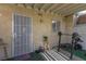 A covered patio featuring a weight bench and security door at 431 Las Casitas Way, Las Vegas, NV 89121