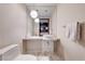 Minimalist bathroom with white fixtures, marble-tiled floor and vanity, and modern lighting at 4381 W Flamingo # 2201, Las Vegas, NV 89103