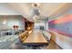 Spacious kitchen with stainless steel appliances, a large dining table, and modern pendant lights at 4381 W Flamingo # 2201, Las Vegas, NV 89103