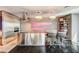 Bright kitchen area with stainless steel appliances, a spacious island, and a modern dining setup at 4381 W Flamingo # 2201, Las Vegas, NV 89103