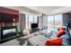 Bright living room with a fireplace, comfortable seating, and scenic views from floor-to-ceiling windows at 4381 W Flamingo # 2201, Las Vegas, NV 89103
