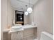 Contemporary bathroom featuring a marble countertop and modern spherical pendant lighting at 4381 West Flamingo Rd # 8322, Las Vegas, NV 89103
