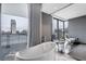 Modern bathroom with a freestanding tub and views of the vibrant cityscape at 4381 West Flamingo Rd # 8322, Las Vegas, NV 89103