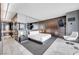 Modern bedroom featuring a sleek platform bed, mirrored wall, and stylish contemporary decor at 4381 West Flamingo Rd # 8322, Las Vegas, NV 89103