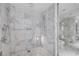 Walk-in shower with marble tiling and modern fixtures next to the toilet room at 4381 West Flamingo Rd # 8322, Las Vegas, NV 89103