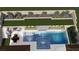 Aerial view of backyard with pool, spa, outdoor kitchen, fireplace, and landscaped areas at 441 Beautiful Hill Ct, Las Vegas, NV 89138