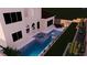 Backyard oasis with a pool, spa, outdoor kitchen, and lush, private landscaping at 441 Beautiful Hill Ct, Las Vegas, NV 89138