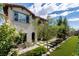 Charming two-story home with manicured lawn, mature trees, and beautiful landscaping at 441 Beautiful Hill Ct, Las Vegas, NV 89138