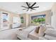 Bright main bedroom with a fan, large window, neutral decor, and a door to a private balcony at 441 Beautiful Hill Ct, Las Vegas, NV 89138