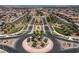 Stunning community entrance with meticulously landscaped roundabout and manicured green spaces at 441 Beautiful Hill Ct, Las Vegas, NV 89138
