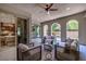 Beautiful outdoor living space with covered seating and backyard vistas at 441 Beautiful Hill Ct, Las Vegas, NV 89138