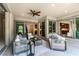 Inviting covered patio featuring elegant furniture and views of the backyard at 441 Beautiful Hill Ct, Las Vegas, NV 89138