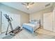 Bedroom with hardwood floors, a ceiling fan, an exercise machine, and a comfortable bed at 4680 Peppertree St, Pahrump, NV 89061