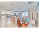 Open-concept living room featuring modern furniture, hardwood flooring, and a view of the outdoor living space at 4680 Peppertree St, Pahrump, NV 89061