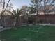 Landscaped backyard featuring a green lawn, perimeter trees, and mature landscaping at 4739 Laurel Canyon St, Las Vegas, NV 89129