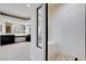Framed shower with seat adjacent to main bathroom and fireplace at 5148 Villa Vecchio Ct, Las Vegas, NV 89141