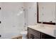 Bathroom with a shower and tub combination, complemented by a dark wood vanity and white countertop at 5148 Villa Vecchio Ct, Las Vegas, NV 89141