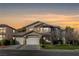 Charming two-story home showcasing manicured landscaping and a three-car garage at 5148 Villa Vecchio Ct, Las Vegas, NV 89141