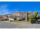 Charming two-story home showcasing manicured landscaping and a three-car garage at 5148 Villa Vecchio Ct, Las Vegas, NV 89141