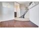 Spacious foyer featuring a grand staircase, dark wood floors, and high ceilings, creating an impressive entry at 5148 Villa Vecchio Ct, Las Vegas, NV 89141