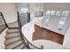 Foyer with winding staircase and large windows providing ample natural light at 5148 Villa Vecchio Ct, Las Vegas, NV 89141