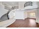 Bright foyer with grand staircase, wrought iron railing, and hardwood floors, showcasing an elegant entrance to the home at 5148 Villa Vecchio Ct, Las Vegas, NV 89141