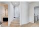 Open hallway leading to a modern bathroom and laundry room at 5148 Villa Vecchio Ct, Las Vegas, NV 89141