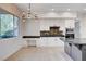 Bright kitchen with stylish cabinetry, sleek appliances, and modern lighting at 5148 Villa Vecchio Ct, Las Vegas, NV 89141