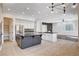 Open kitchen featuring a center island, stainless appliances, and breakfast bar at 5148 Villa Vecchio Ct, Las Vegas, NV 89141