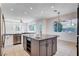 Bright kitchen with stainless steel appliances, center island, and breakfast bar at 5148 Villa Vecchio Ct, Las Vegas, NV 89141