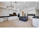 Spacious kitchen with white cabinets, stainless appliances, and a large center island at 5148 Villa Vecchio Ct, Las Vegas, NV 89141