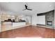 Spacious living area with stone fireplace, open to the kitchen, with modern finishes and ample natural light at 5148 Villa Vecchio Ct, Las Vegas, NV 89141