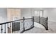 An open loft area with views of the front door below at 5148 Villa Vecchio Ct, Las Vegas, NV 89141