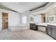 Bright main bathroom featuring a soaking tub, dual vanity, and modern fixtures at 5148 Villa Vecchio Ct, Las Vegas, NV 89141