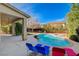 Backyard featuring a refreshing pool, jacuzzi, and lounging area at 5148 Villa Vecchio Ct, Las Vegas, NV 89141