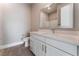 Modern bathroom with white cabinetry, sleek countertops, and framed mirror at 5371 Brevin Ct, Las Vegas, NV 89131