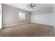 Bedroom featuring neutral walls, carpet flooring, and large window at 5371 Brevin Ct, Las Vegas, NV 89131