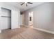 Neutral bedroom features a closet with carpeted floors and a bathroom at 5371 Brevin Ct, Las Vegas, NV 89131